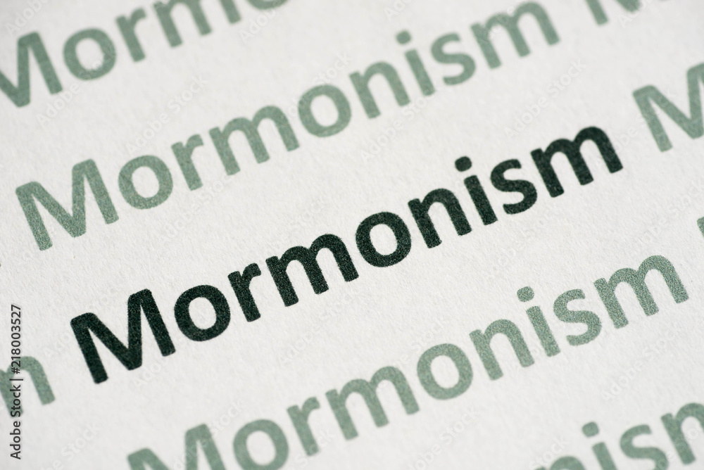 Fototapeta premium word Mormonism printed on paper macro