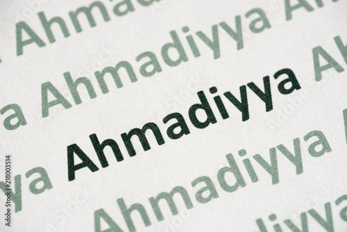 word Ahmadiyya printed on paper macro photo