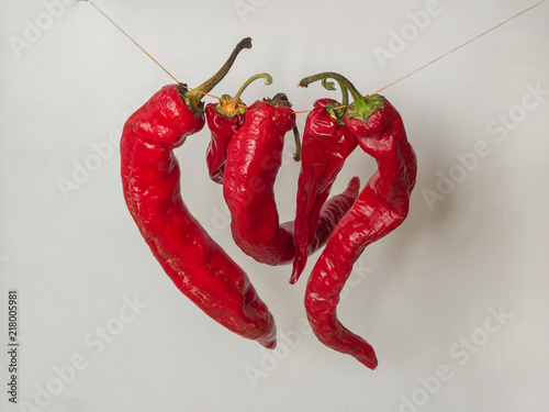 Five red hot peppers photo