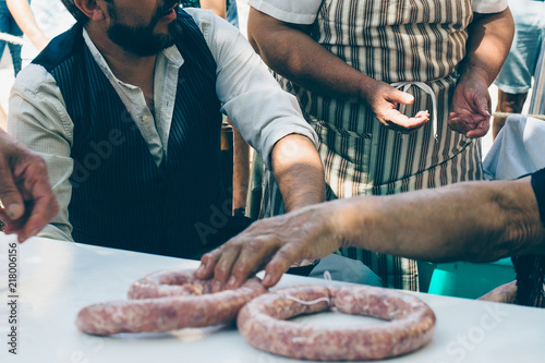 Man makes artisan sausage photo