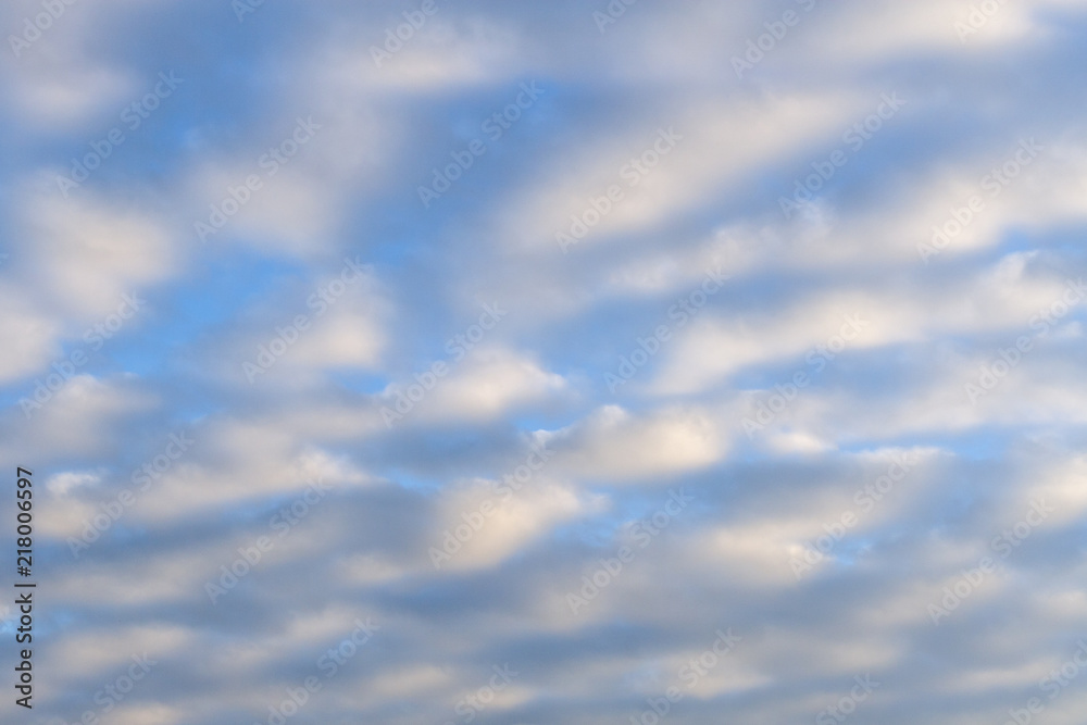 A blue cloudy sky. Background.