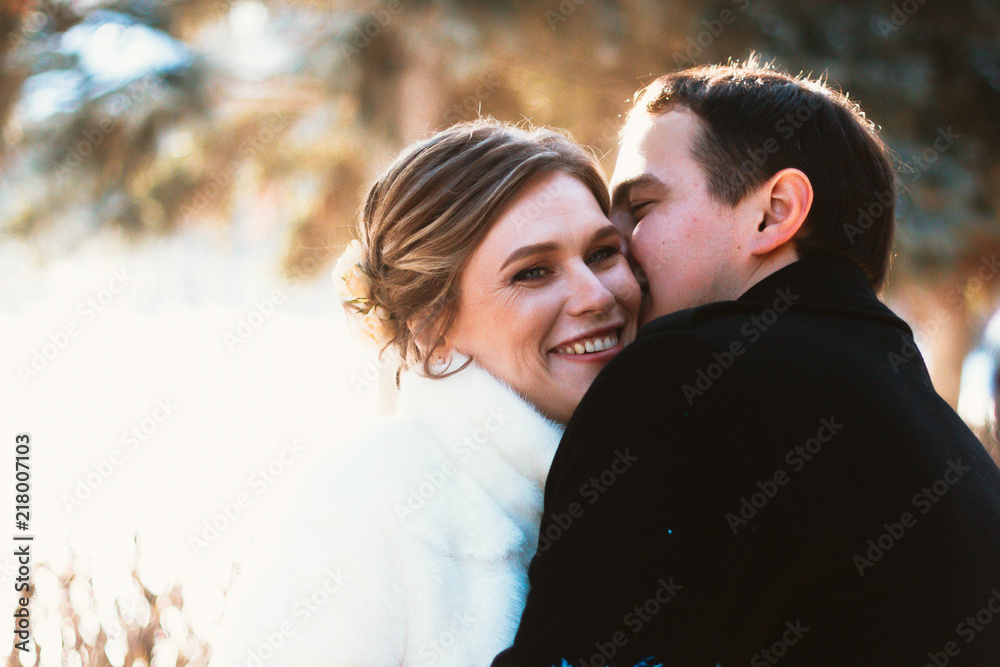 Lovers bride and groom on their winter wedding Lovers bride and groom on their winter wedding
