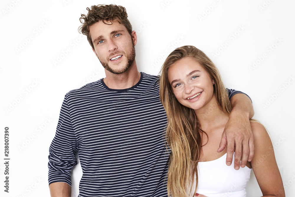 Fototapeta premium Handsome couple in white studio, portrait