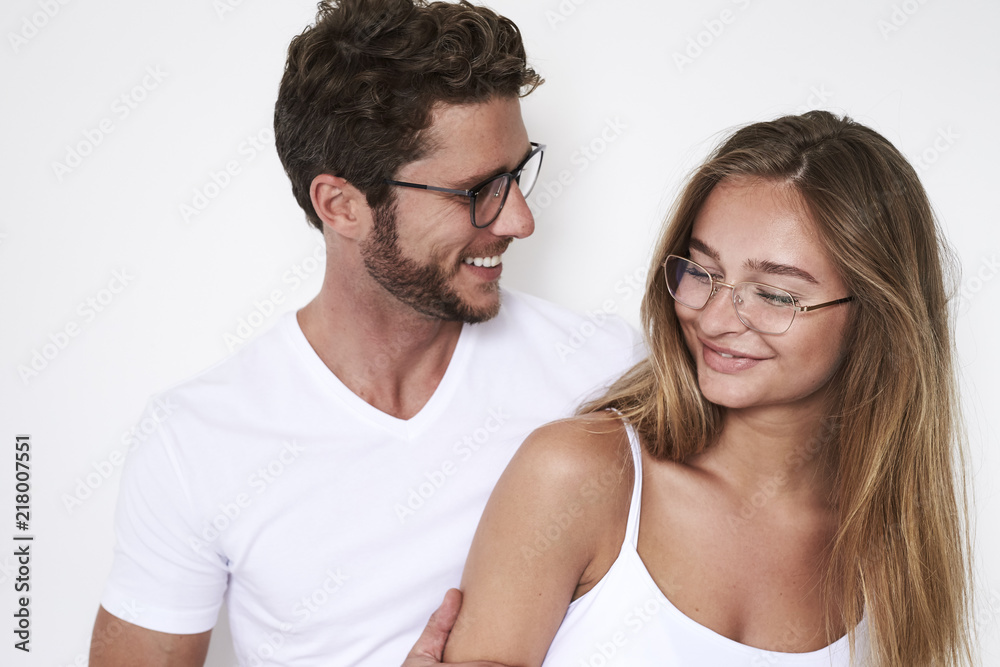 Laughing young couple in eyeglasses, studio Laughing young couple in eyeglasses, studio