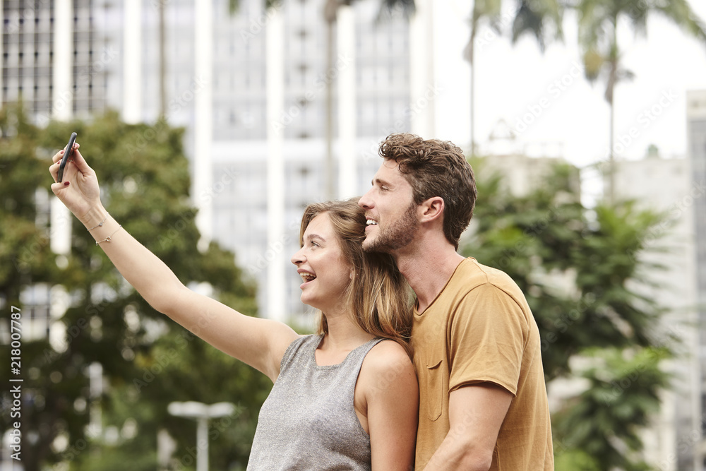 Obraz premium Happy couple selfie in city, brazil