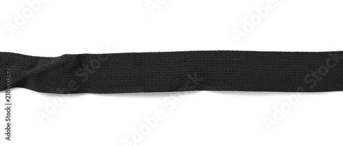 Black synthetic nylon fastening belt, strap isolated on white background, top view