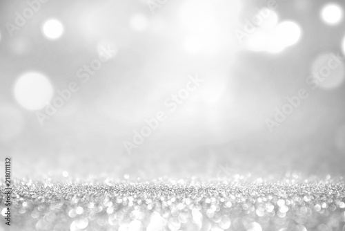 White silver glitter and grey lights bokeh with stars abstract background holiday. photo