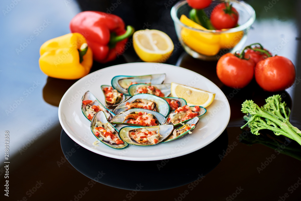 Baked mussels with cheese and garlic