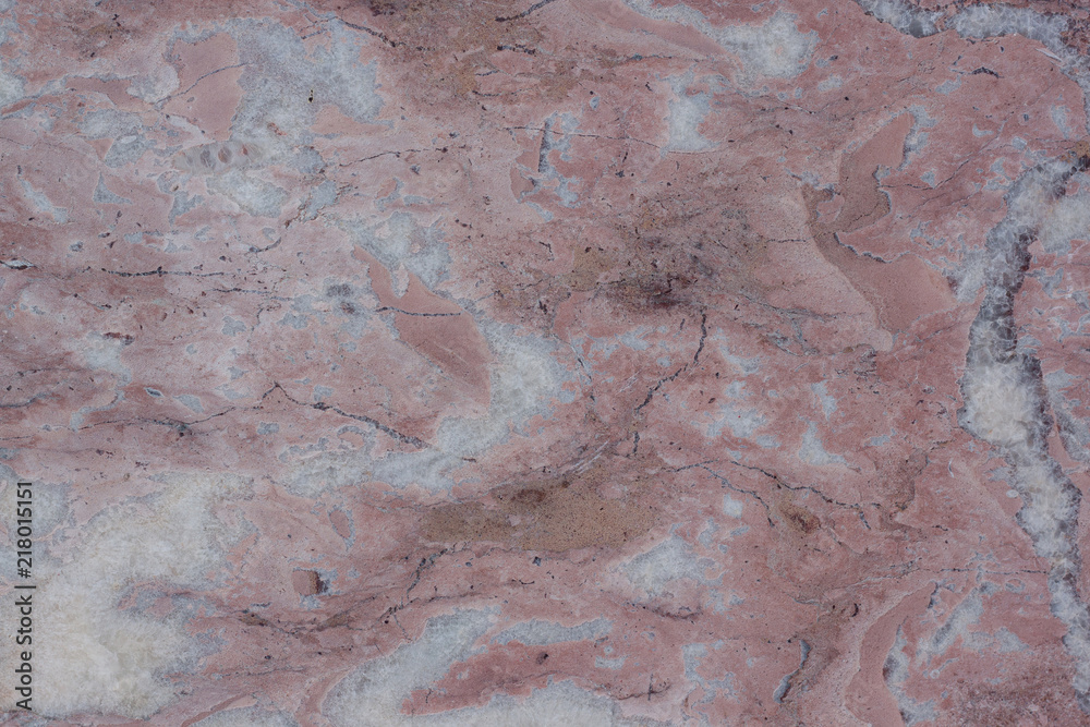 Classic travertine texture. Reddish-brown base with dark and gray spots. Used as a background. Classic travertine texture. Reddish-brown base with dark and gray spots. Used as a background.