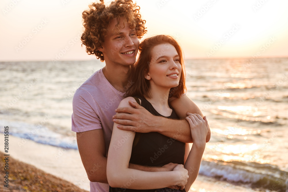 Young happy loving couple hugging