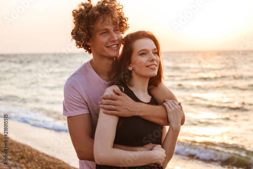 Young happy loving couple hugging