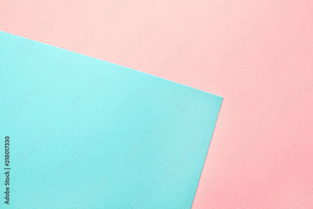 Abstract geometric water color paper background in soft pastel pink and blue trend colors.