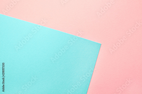 Abstract geometric water color paper background in soft pastel pink and blue trend colors.