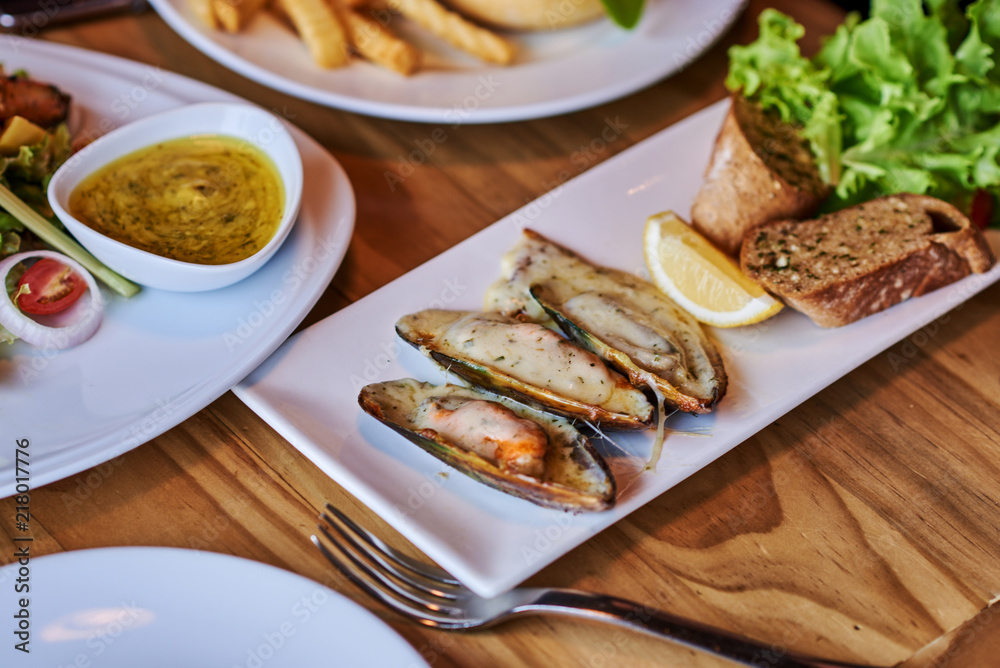 Seafood. Shellfish mussels. Baked mussels with parmesan cheese.