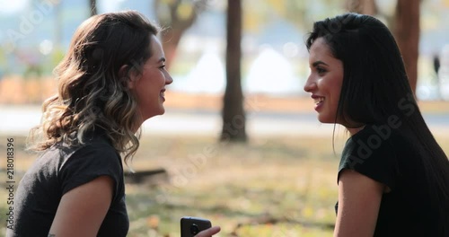 Friends in conversation at the park3 photo