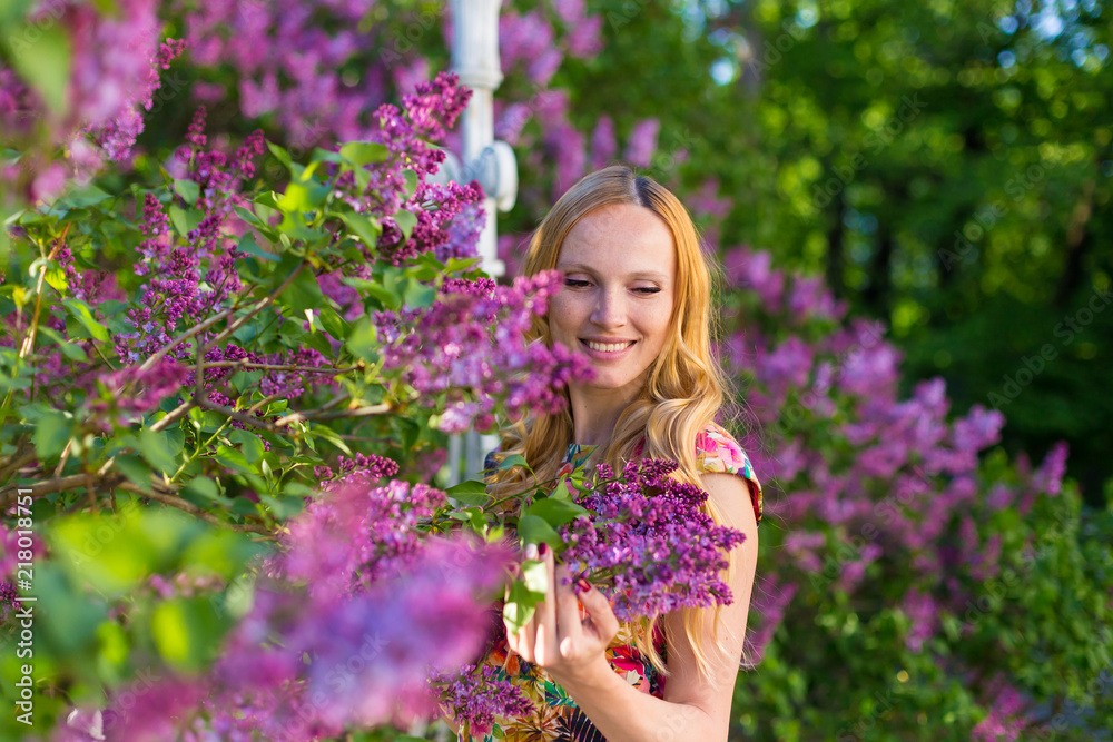 Model in garden with lilac Model in garden with lilac