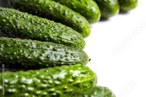 Fresh green cucumbers on white background. Gherkin