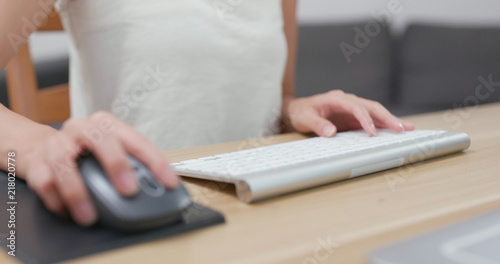 Close up of woman typing on keyboard