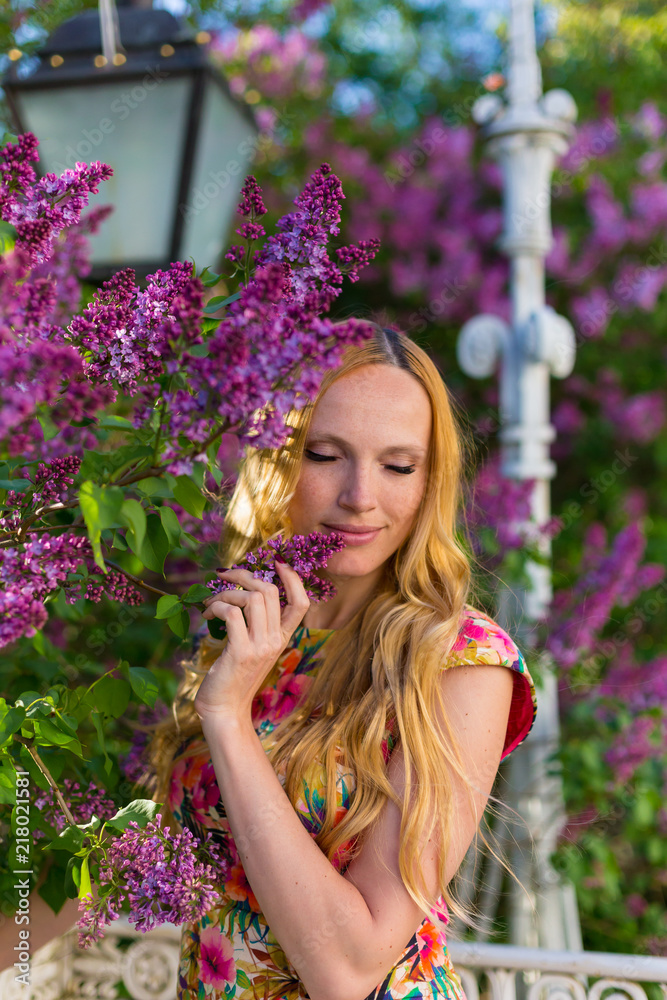Model in garden with lilac Model in garden with lilac