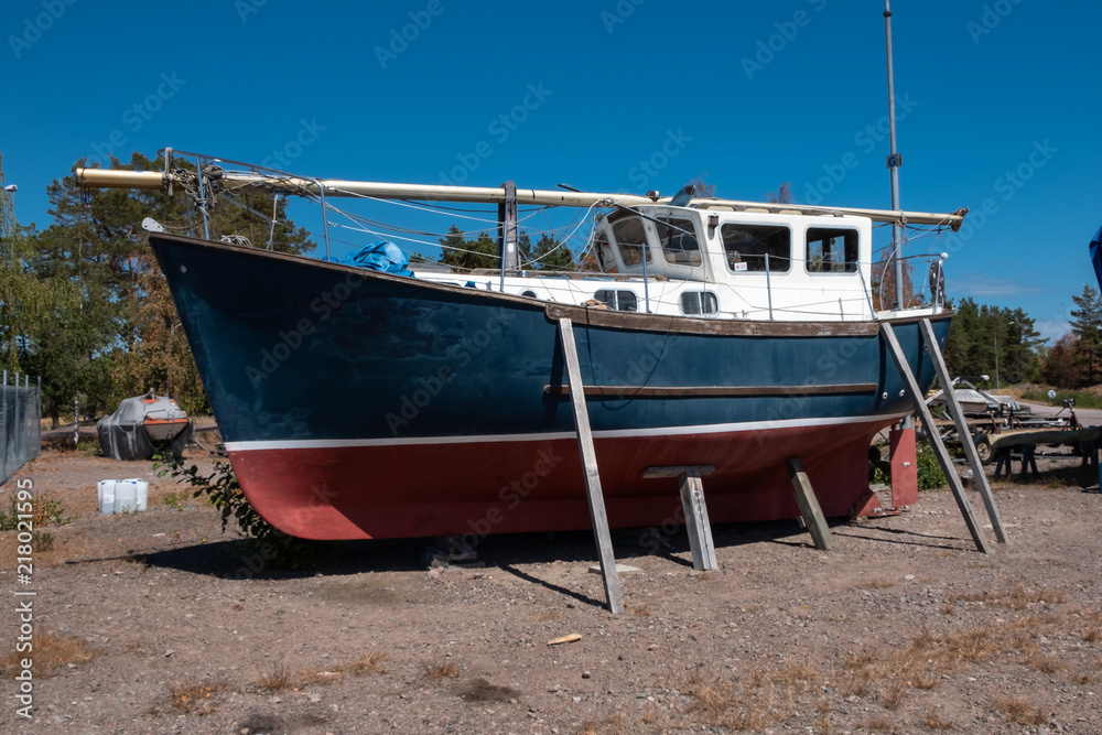 Boat on stand on shore