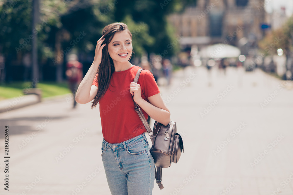 Φωτογραφία Attractive brunette girl with a backpack went for a walk, lookin