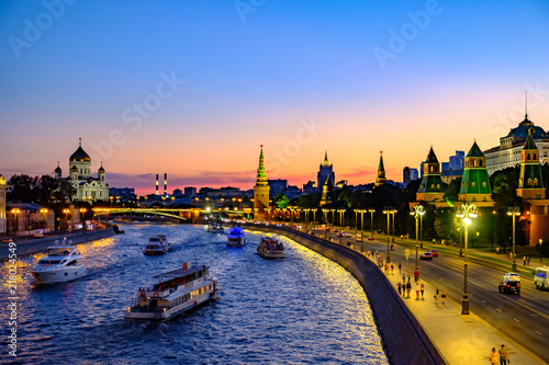 Colorful evening landscape on embankment river and Moscow Kremlin.