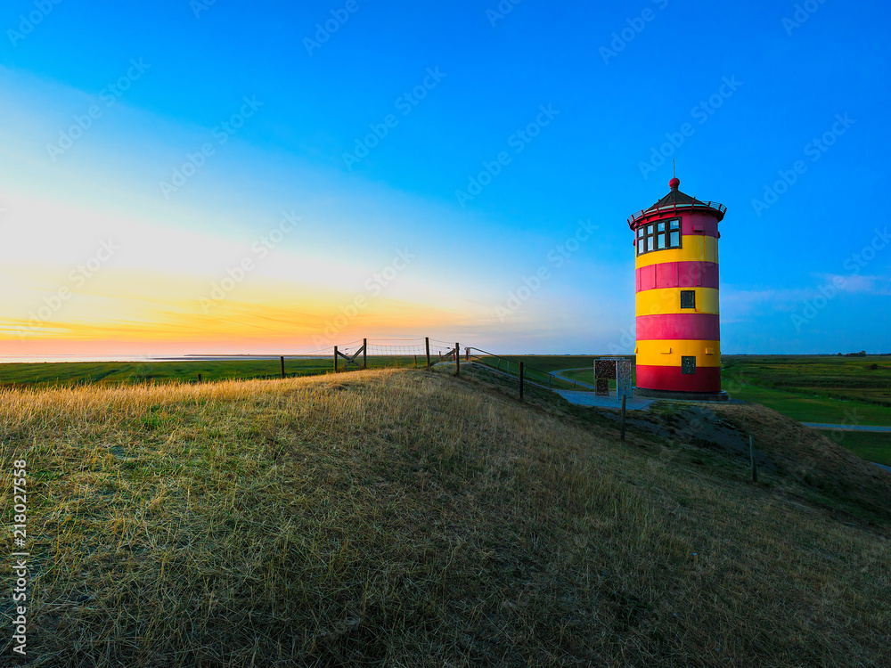 Wunschmotiv: Pilsumer Leuchtturm bei Sonnenuntergang #218027558