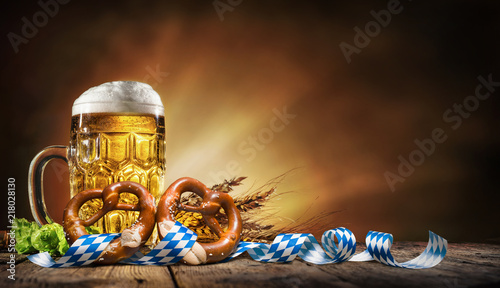 Oktoberfest beer with pretzel, wheat and hops photo