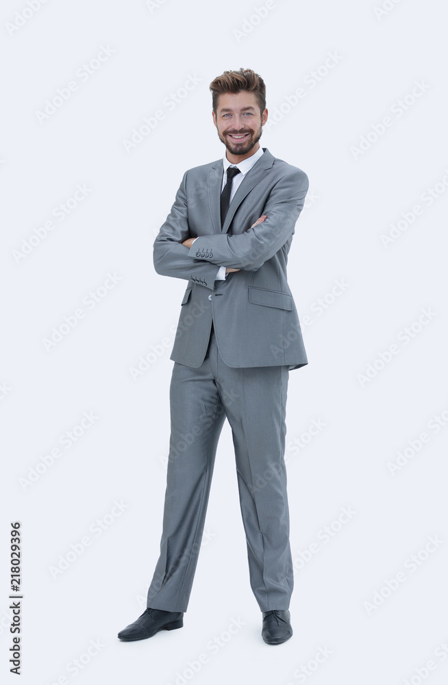 Obraz premium Full length of a young caucasian businessman with arms folded