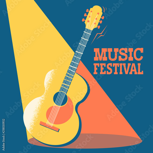 Acoustic guitar on stage with text