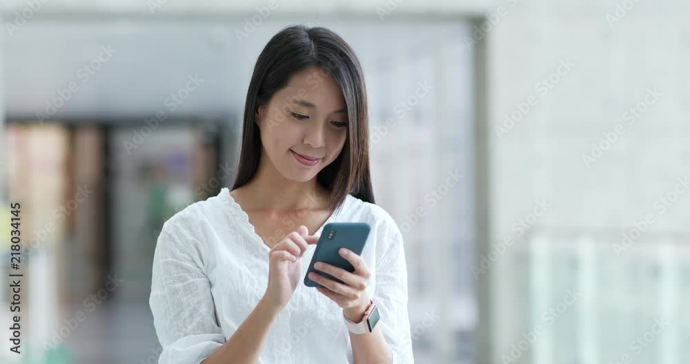 Woman use of cellphone in campus Woman use of cellphone in campus
