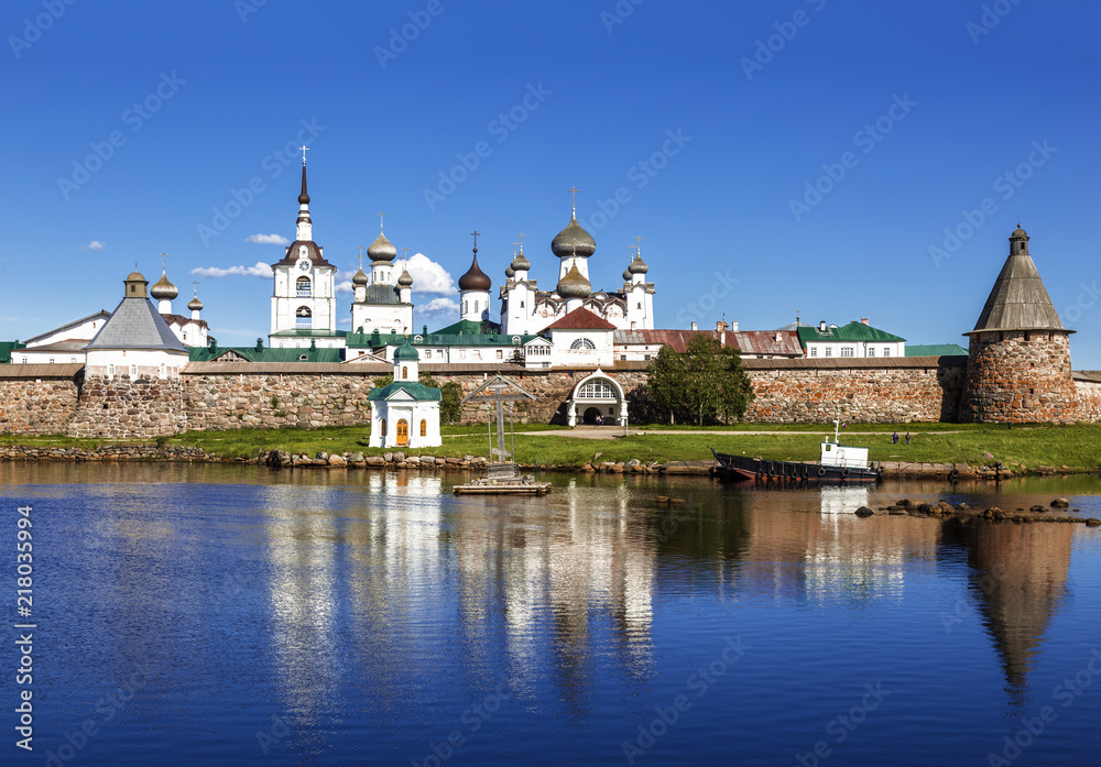 Spaso-Preobrazhensky the Solovetsky Stavropegial monastery with worship the cross in the bay of Well-being on the Bolshoy Solovetsky island in the White sea. Arkhangelsk region, Russia