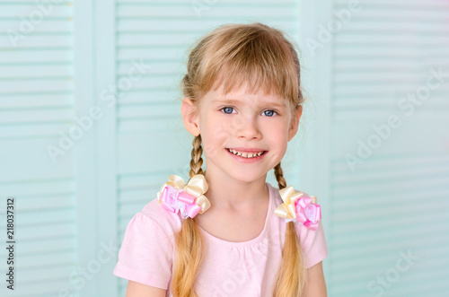 smiling girl with pigtails