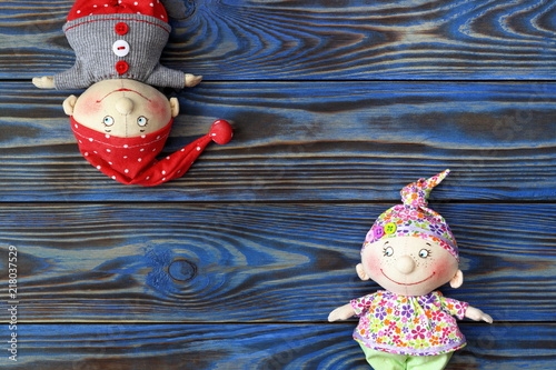 Two dolls of funny kids in sleeping caps. Handmde textile doll. photo