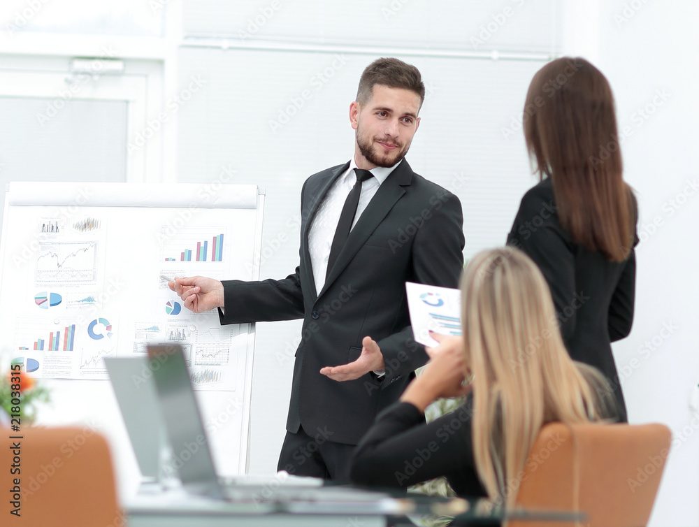 businessman makes a presentation to his business team businessman makes a presentation to his business team