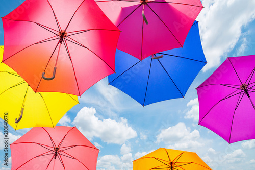 Colorful umbrellas background. Colorful umbrellas in the sky. Street decoration.
