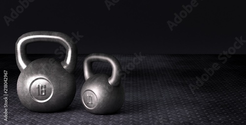 Fitness background with kettlebells on dark Background