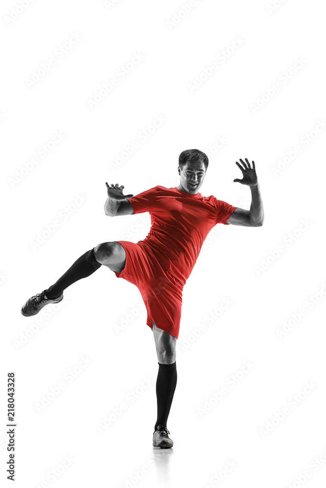 Professional football soccer player in motion isolated on white studio background Professional football soccer player in motion isolated on white studio background