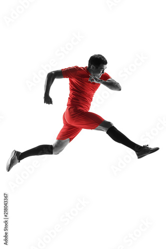 Professional football soccer player in motion isolated on white studio background © master1305