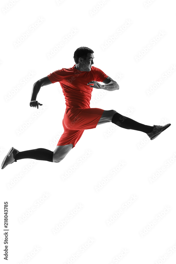 Professional football soccer player in motion isolated on white studio background