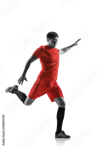 Professional football soccer player in motion isolated on white studio background