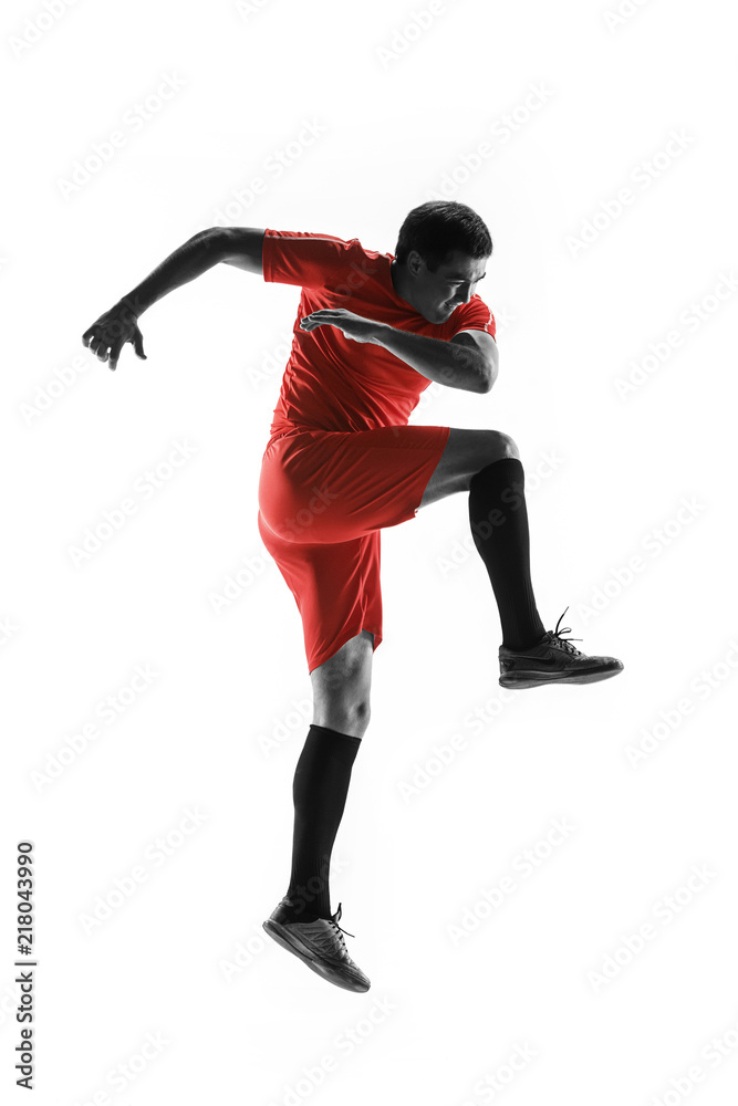 Professional football soccer player in motion isolated on white studio background