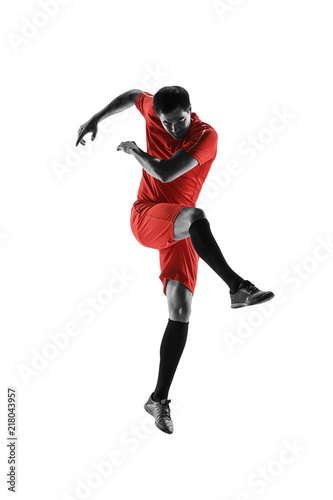 Professional football soccer player in motion isolated on white studio background © master1305