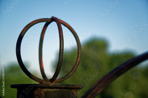 Steel fence in public park, defocused background