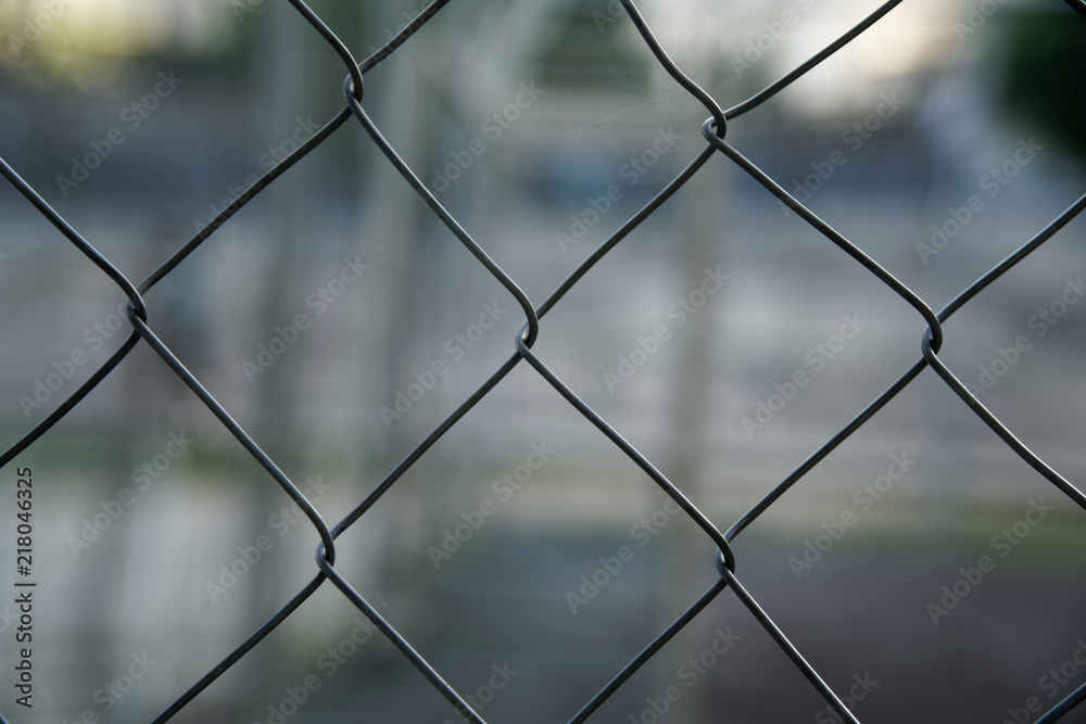 Mesh aluminium wire with defocused background, business concept Mesh aluminium wire with defocused background, business concept