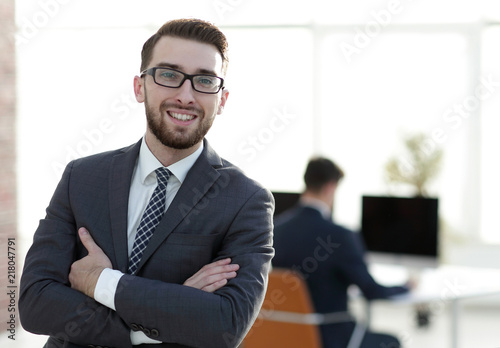 successful businessman on background of office