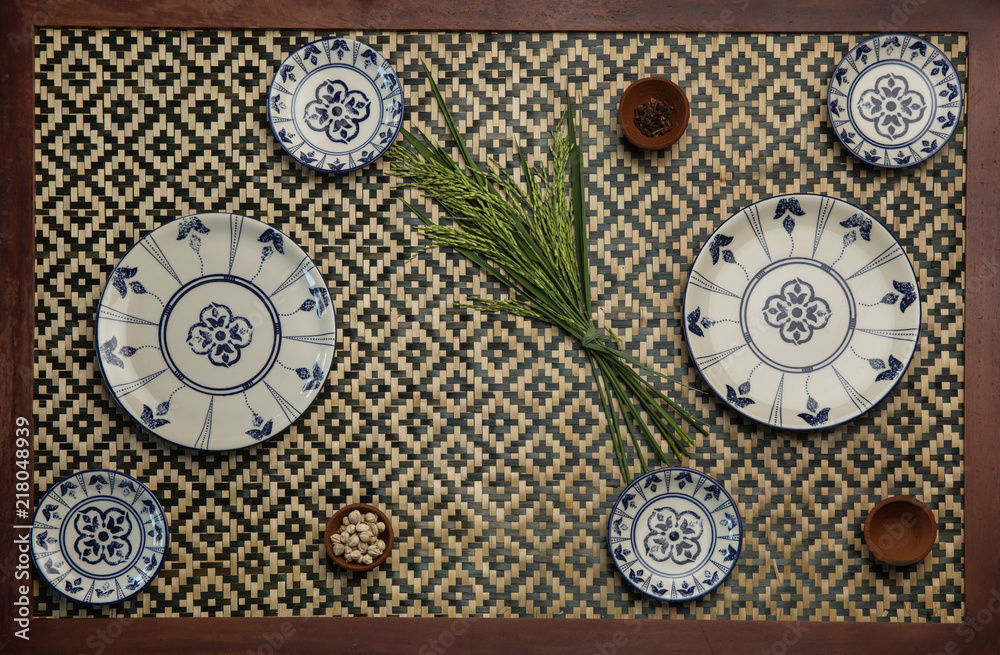 Plates arranging on the wooden table, top view. Tableware in form of plates