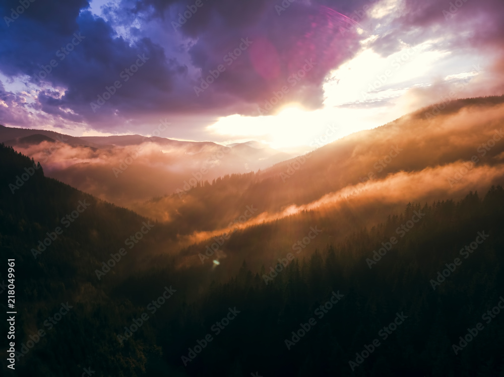 beautiful aerial view of the mountains and the blue lake, the sunset after the rain, the coniferous forest, the purple clouds, Best place in, tourism and nature concept, the Carpathians Ukraine