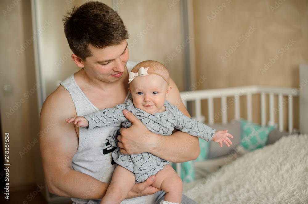 Happy father holding a newborn baby girl in his arms Stock Photo | Adobe  Stock