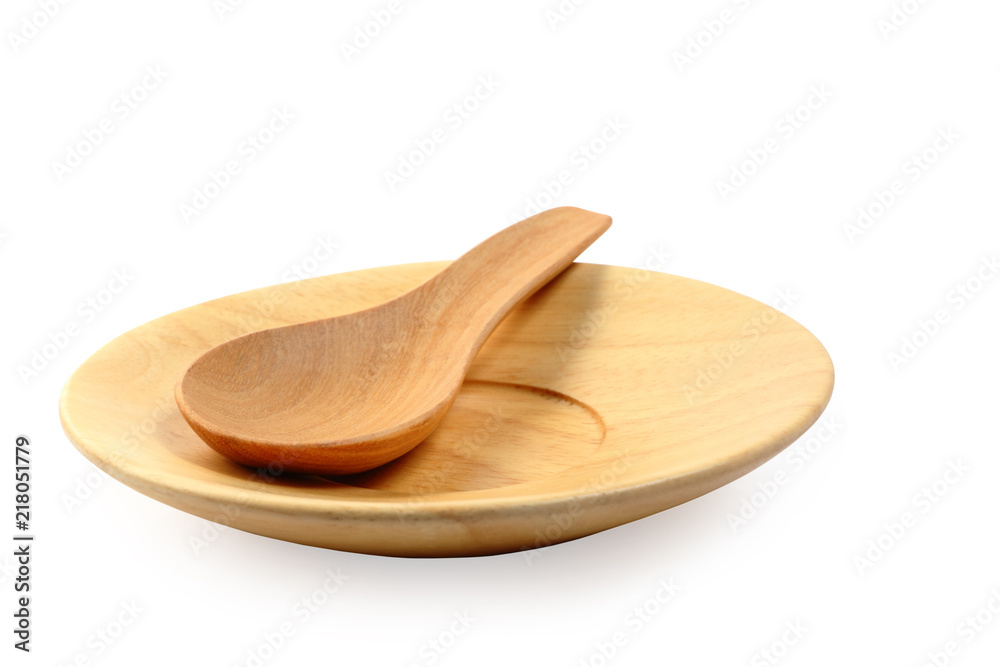 Wooden plate and tablespoon isolated clipping path. Wooden plate and tablespoon isolated clipping path.